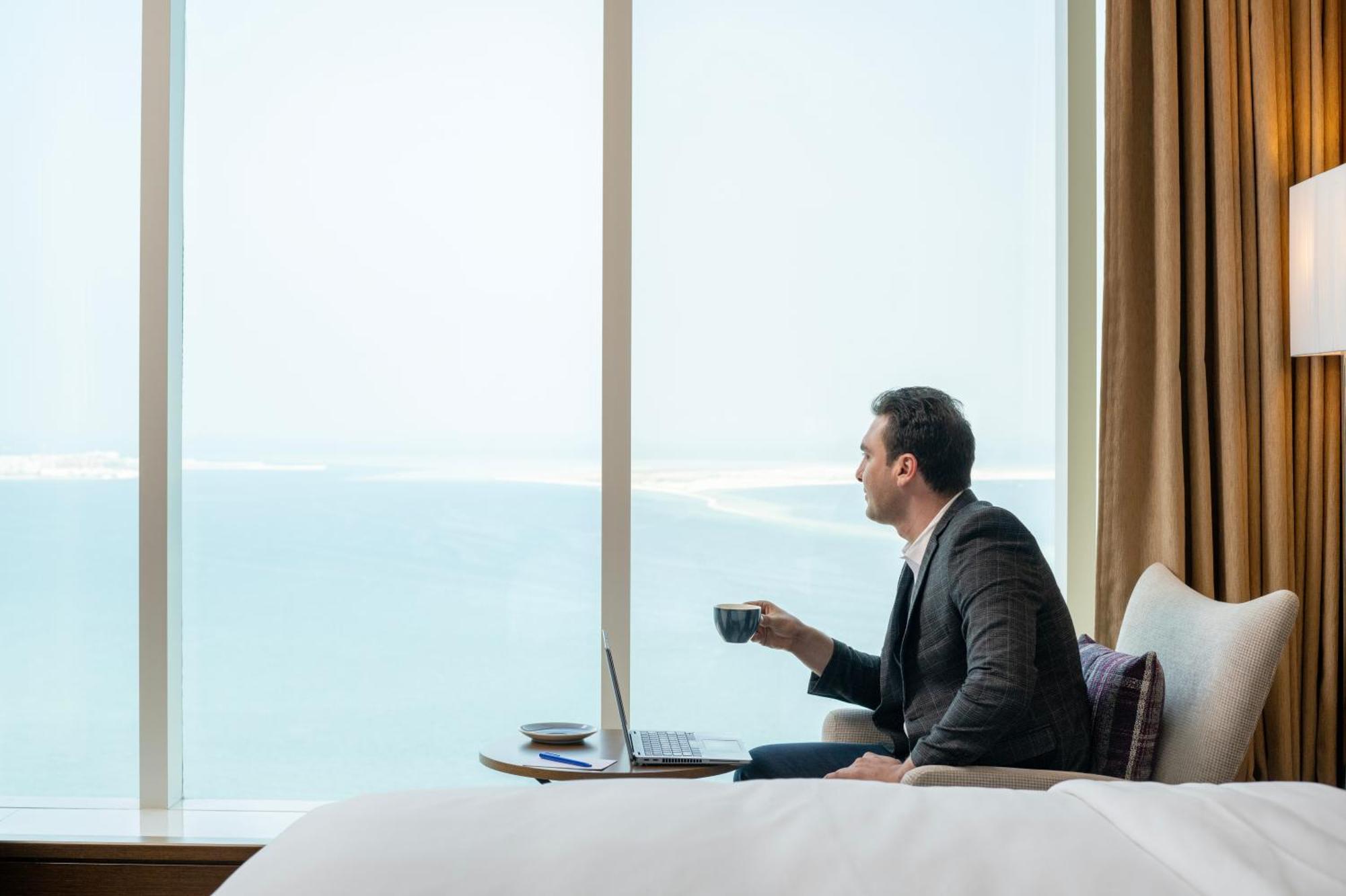 Delta Hotels By Marriott City Center Doha Bagian luar foto A guest enjoying the view from a room at the hotel